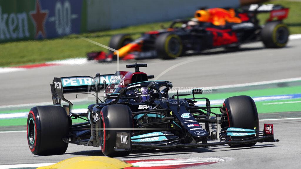 Emilio Morenatti Mercedes driver Lewis Hamilton of Britain takes a curve followed by Red Bull driver Max Verstappen of the Netherlands, in the background, during the third free practice for the Spanish Formula One Grand Prix at the Barcelona Catalunya racetrack in Montmelo, just outside Barcelona, Spain, Saturday, May 8, 2021. The Spanish Grand Prix will be held on Sunday. (AP Photo/Emilio Morenatti)