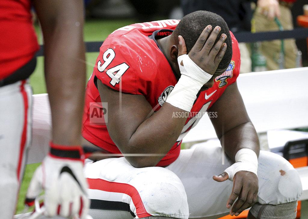 Curtis Compton Georgia defensive tackle Michael Barnett sits on the bench in the final minutes of the team's 28-21 loss to Texas during the Sugar Bowl NCAA college football game Tuesday, Jan. 1, 2019, in New Orleans. (Curtis Compton/Atlanta Journal Constitution via AP)