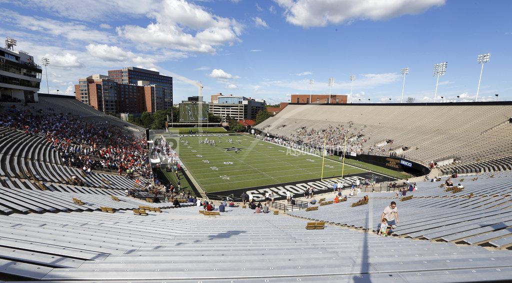 Mark Humphrey Fans watch an NCAA college football game between Virginia and Ohio being played in Vanderbilt Stadium Saturday, Sept. 15, 2018, in Nashville, Tenn. The game was moved to Nashville because of Hurricane Florence and fans were admitted for free. (AP Photo/Mark Humphrey)