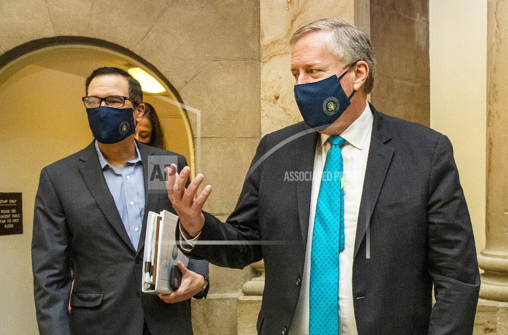 Manuel Balce Ceneta White House chief of staff Mark Meadows, right, and Treasury Secretary Steven Mnuchin, arrive at the office of House Speaker Nancy Pelosi at the Capitol to resume talks on a COVID-19 relief bill, Saturday, Aug. 1, 2020, in Washington. (AP Photo/Manuel Balce Ceneta)