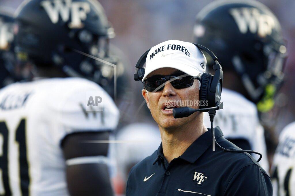 Michael Dwyer Wake Forest head coach Dave Clawson stands on the field during a timeout in the second half of an NCAA college football game against Boston College in Boston, Saturday, Sept. 28, 2019. (AP Photo/Michael Dwyer)