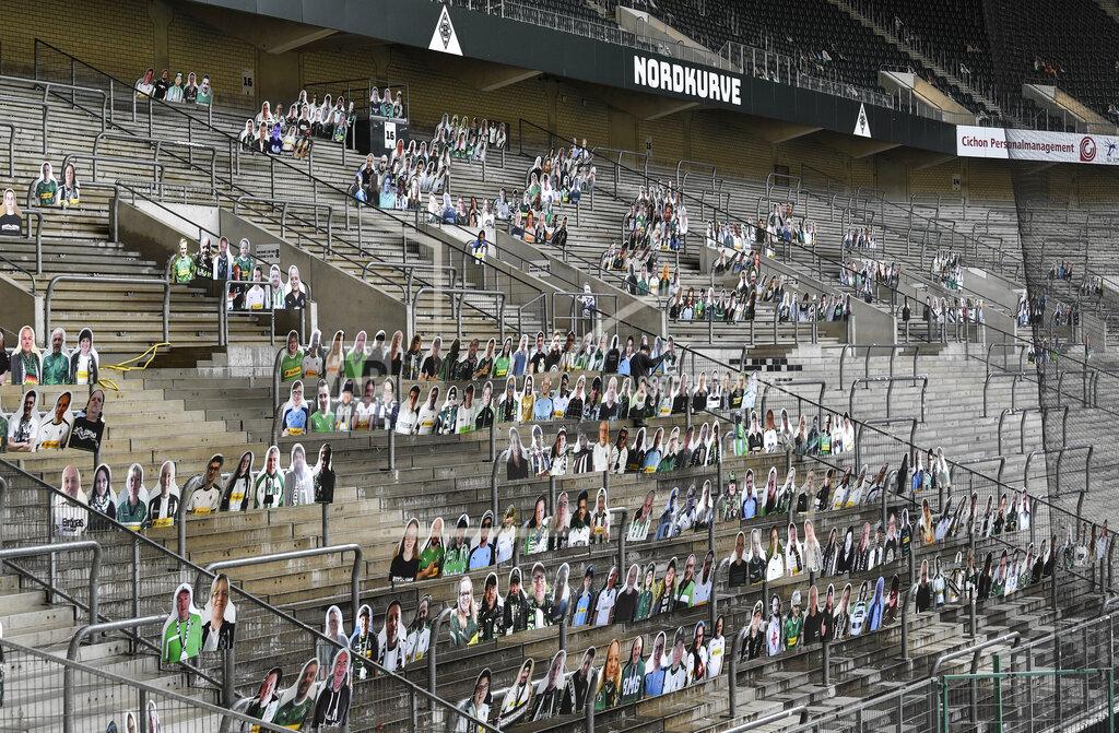 Martin Meissner FILE - In this Thursday, April 16, 2020 file photo, portraits of fans of German Bundesliga soccer club Borussia Moenchengladbach are set on the supporters tribune in the stadium in Moenchengladbach, Germany. The coronavirus pandemic has changed almost everything about soccer in Germany, except Bayern Munich's chances of winning. When the Bundesliga resumes on Saturday, May 16 after a two-month suspension caused by the pandemic, Borussia Dortmund and Leipzig will be Bayern's main challengers.(AP Photo/Martin Meissner, file)