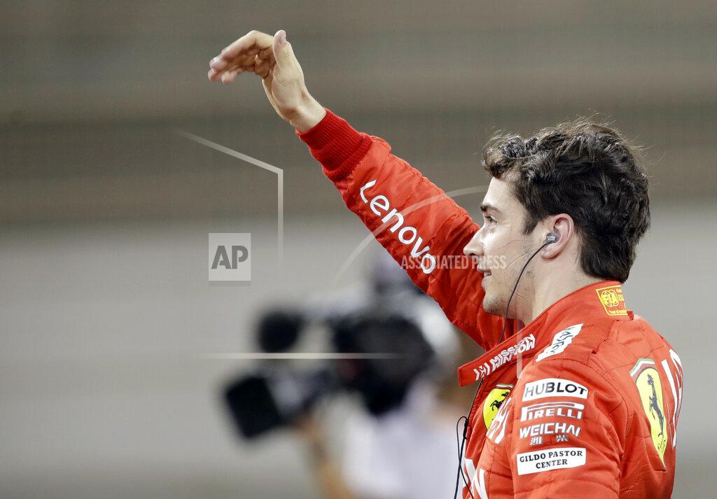 Luca Bruno Ferrari driver Charles Leclerc of Monaco celebrates his pole position after the qualifying session at the Formula One Bahrain International Circuit in Sakhir, Bahrain, Saturday, March 30, 2019. The Bahrain Formula One Grand Prix will take place on Sunday. (AP Photo/Luca Bruno)