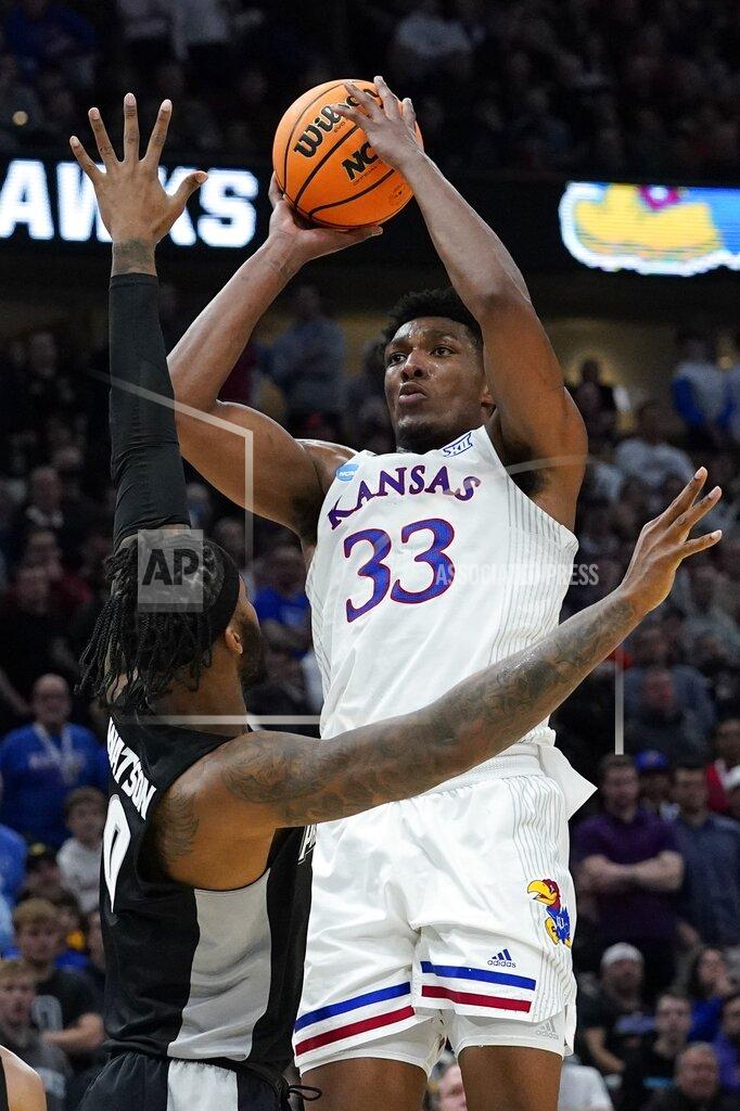 Nam Y. Huh Kansas' David McCormack shoots over Providence's Nate Watson during the second half of a college basketball game in the Sweet 16 round of the NCAA tournament Friday, March 25, 2022, in Chicago. (AP Photo/Nam Y. Huh)