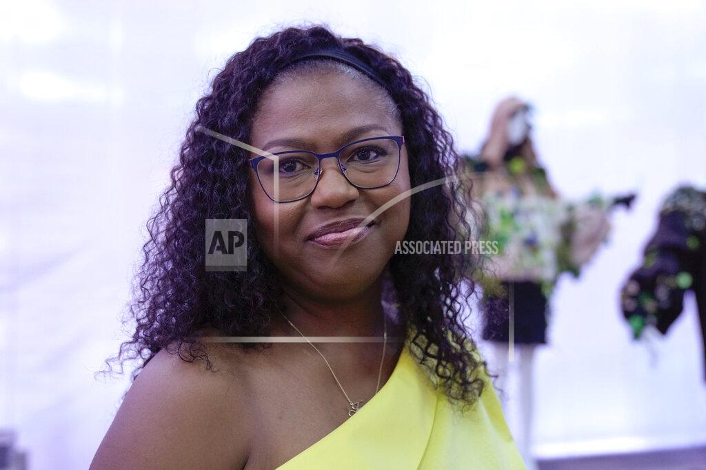 Luca Bruno Designer Joy Meribe poses for a photo in the backstage of her Spring Summer 2022 collection, unveiled during the Milan Fashion Week, in Milan, Italy, Wednesday, Sept. 22, 2021. (AP Photo/Luca Bruno)