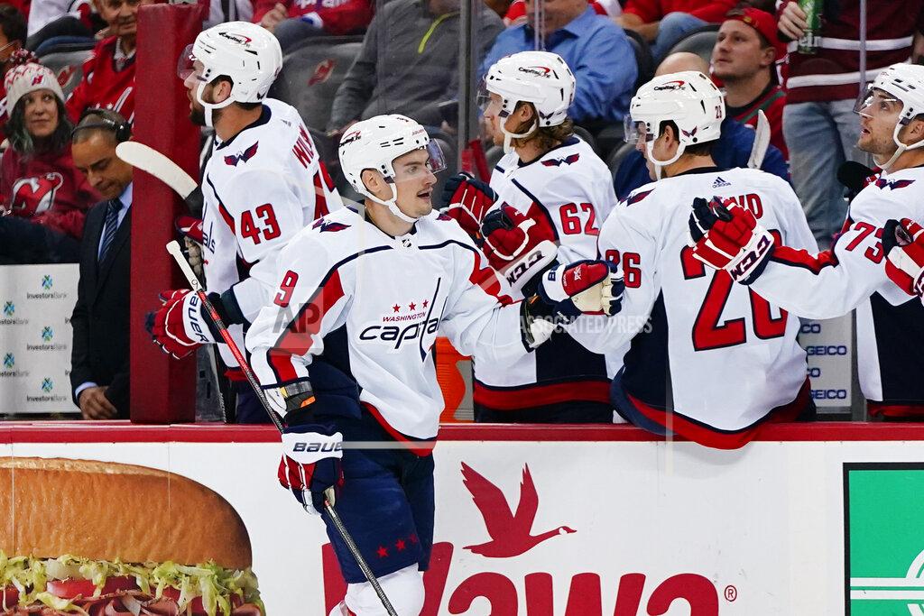 Frank Franklin Ii Washington Capitals' Dmitry Orlov (9) celebrates with teammates after scoring a goal during the first period of the team's NHL hockey game against the New Jersey Devils on Thursday, Oct. 21, 2021, in Newark, N.J. (AP Photo/Frank Franklin II)