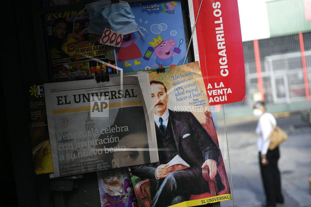 Matias Delacroix Newspapers and magazines feature the late, Venezuelan Dr. Jose Gregorio Hernandez on the day of his Beatification ceremony in Caracas, Venezuela, Friday, April 30, 2021. Known as the "doctor of the poor, Hernandez will beatified Friday by the Catholic church, a step towards sainthood. (AP Photo/Matias Delacroix)