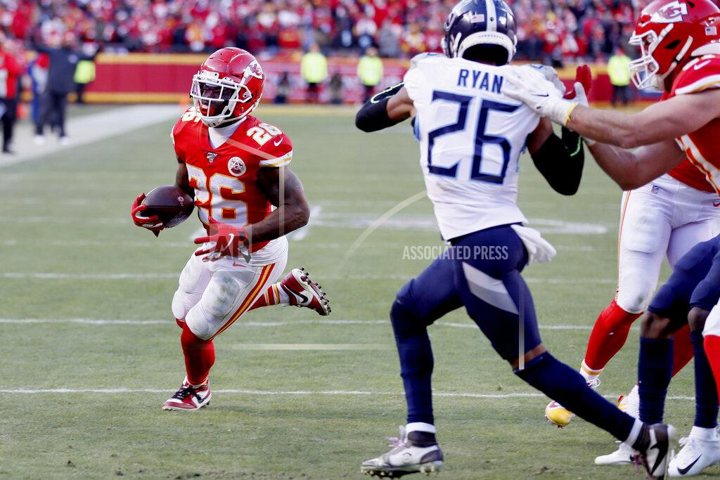 Charlie Neibergall Kansas City Chiefs' Damien Williams runs for a touchdown past Tennessee Titans cornerback Logan Ryan (26) during the second half of the NFL AFC Championship football game Sunday, Jan. 19, 2020, in Kansas City, MO. (AP Photo/Charlie Neibergall)