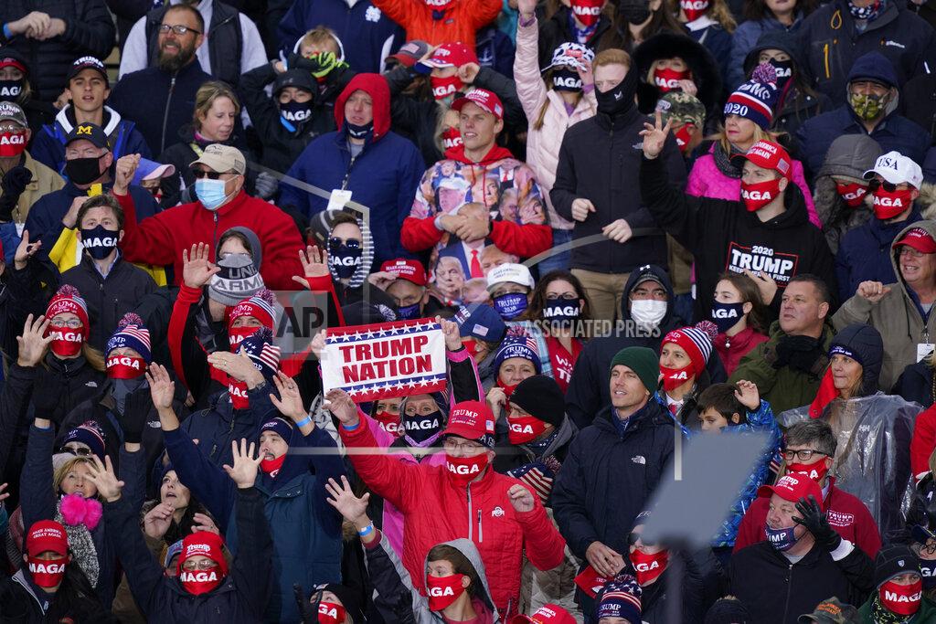 Carlos Osorio Supporters of President Donald Trump cheer as he speaks at a campaign rally, Saturday, Oct. 17, 2020, in Norton Shores, Mich. (AP Photo/Carlos Osorio)