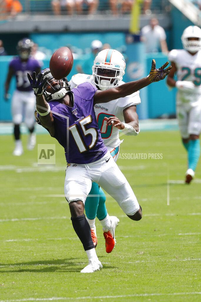 Wilfredo Lee Baltimore Ravens wide receiver Marquise Brown (15) attempts to grab a pass as Miami Dolphins defensive back Chris Lammons (30) defends, during the first half at an NFL football game, Sunday, Sept. 8, 2019, in Miami Gardens, Fla. (AP Photo/Wilfredo Lee)