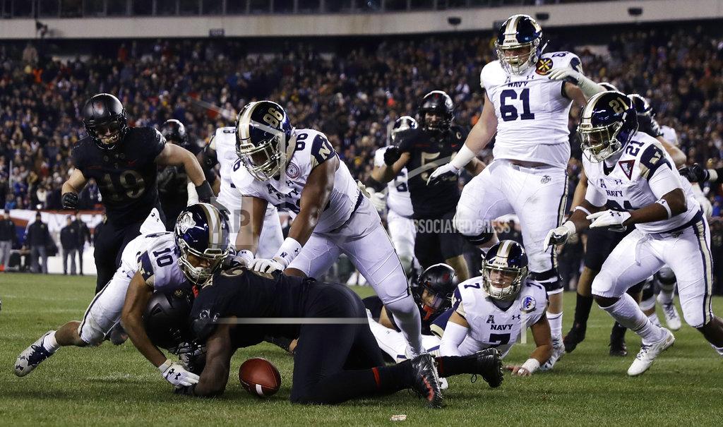 Matt Slocum Army's James Gibson (2) recovers a fumble against Navy's Malcolm Perry (10) and OJ Davis (86) during the second half of an NCAA college football game, Saturday, Dec. 8, 2018, in Philadelphia. Army won 17-10. (AP Photo/Matt Slocum)