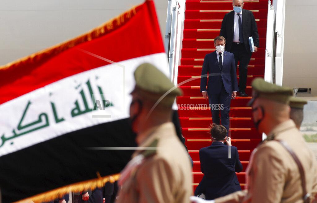 Gonzalo Fuentes French President Emmanuel Macron gets off a plane as he arrives at Baghdad airport, Iraq, Wednesday, Sept. 2, 2020. Macron is the first head of state to visit the Iraqi capital since Prime Minister Mustafa al-Kadhimi, Iraq's former intelligence chief, formed a new government in May. (Gonzalo Fuentes/Pool via AP)