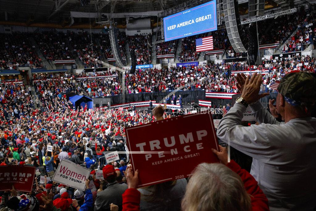 FILE - In this Feb. 28, 2020, file photo President Donald Trump speaks at a campaign rally in North Charleston, S.C. As the economy faces a once-in-a-century recession, with more than 38 million people out of work, Trump is increasingly talking up a future recovery that probably won't materialize until after the November election. (AP Photo/Jacquelyn Martin)