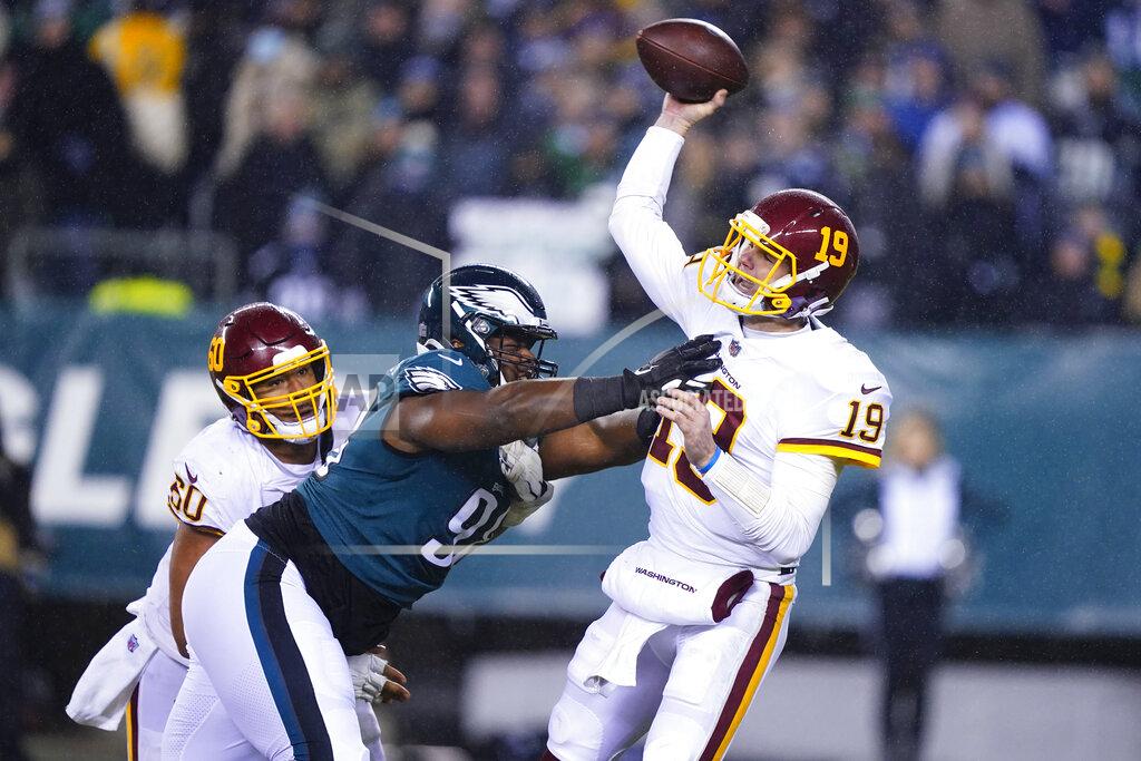Matt Rourke Philadelphia Eagles' Hassan Ridgeway, left, puts pressure on Washington Football Team quarterback Garrett Gilbert, right, during the second half of an NFL football game, Tuesday, Dec. 21, 2021, in Philadelphia. (AP Photo/Matt Rourke)