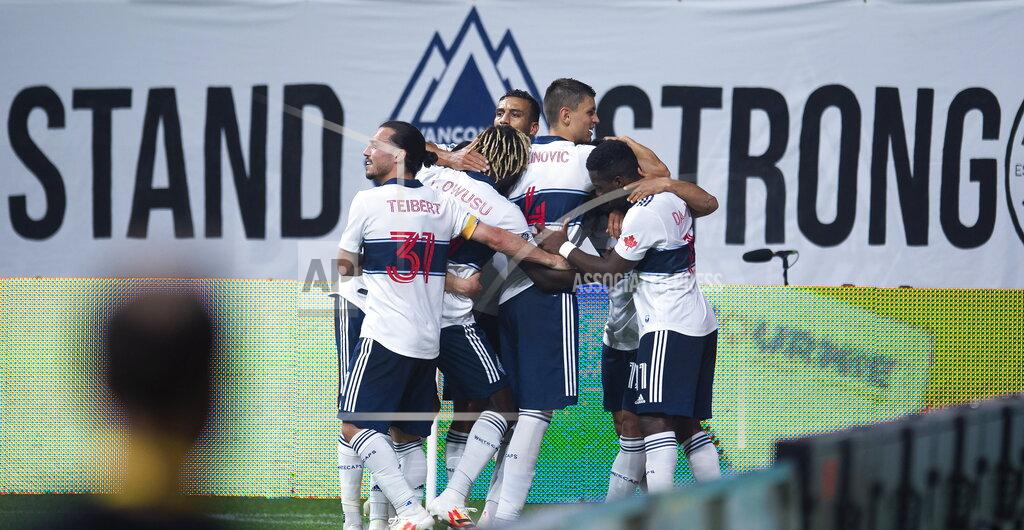 Jonathan Hayward The Vancouver Whitecaps celebrate Fredy Montero's goal against the Montreal Impact during second half MLS soccer action in Vancouver, B.C. Wednesday, September, 16, 2020. THE CANADIAN PRESS/Jonathan Hayward/The Canadian Press via AP)during the second half of an MLS soccer match Wednesday, Sept. 16, 2020, in Vancouver, British Columbia. (Jonathan Hayward/The Canadian Press via AP)
