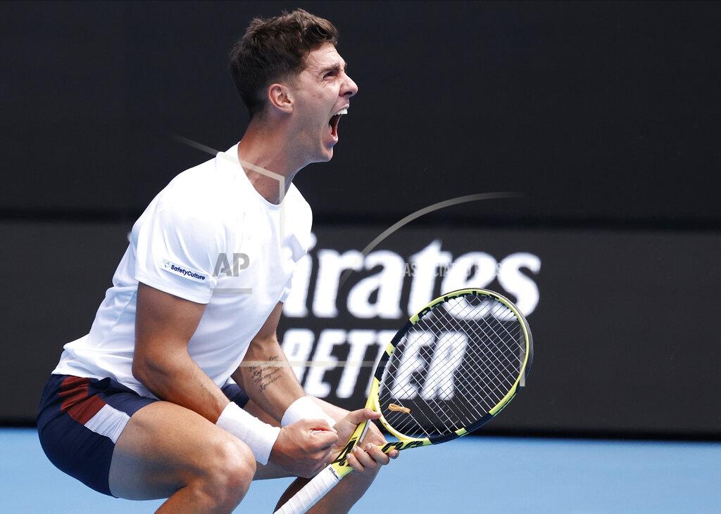 Rick Rycroft Australia's Thanasi Kokkinakis celebrates after winning the fourth set against Greece's Stefanos Tsitsipas during their second round match at the Australian Open tennis championship in Melbourne, Australia, Thursday, Feb. 11, 2021.(AP Photo/Rick Rycroft)