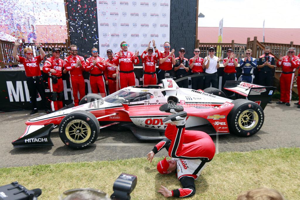 Tom E. Puskar Scott McLaughlin celebrates in Victory Circle after winning an IndyCar auto race at Mid-Ohio Sports Car Course in Lexington, Ohio, Sunday, July 3, 2022. (AP Photo/Tom E. Puskar)