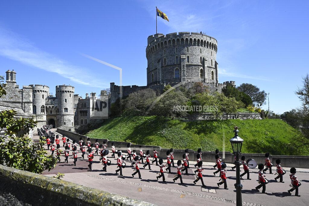 Leon Neal The Grenadier Guards make their way past the Round Tower during the funeral of Britain's Prince Philip inside Windsor Castle in Windsor, England Saturday April 17, 2021. (Leon Neal/Pool via AP)