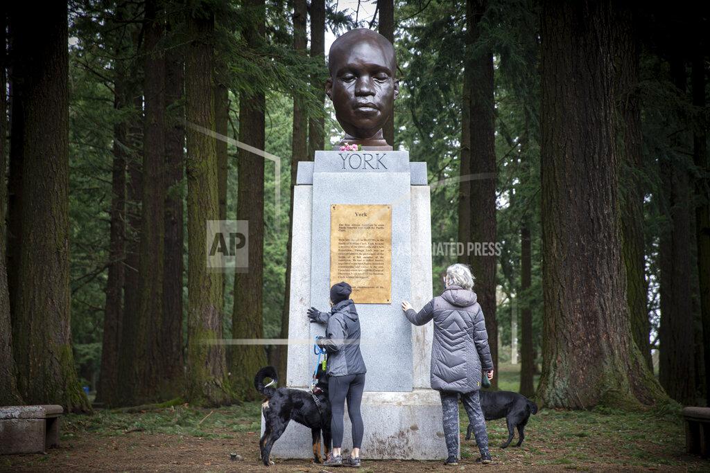 Mark Graves FILE - In this Sunday Feb. 21, 2021, file photo, the bust of York is seen on Mount Tabor in southeast Portland, Ore. Officials say the bust of York, commemorating an enslaved Black member of the Lewis and Clark Expedition was toppled and damaged. A Portland Parks and Recreation spokesperson told KOIN 6 News that the bust of York was torn from its pedestal and significantly damaged Tuesday night, July 27, or early Wednesday. (Mark Graves/The Oregonian via AP, File)