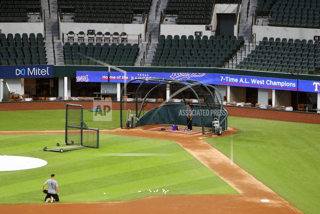 Lm Otero Unidentified players workout at Globe Life Field, home of the Texas Rangers baseball team, in Arlington, Texas, Monday, June 1, 2020. The coronavirus pandemic has forced universities, leagues and franchises to evaluate how they might someday welcome back fans. At baseball games in Taiwan, up to 1,000 spectators have been allowed into the ballpark, but they are barred from bringing in food, concession stands are closed and they are told to sit three seats apart. (AP Photo/LM Otero)