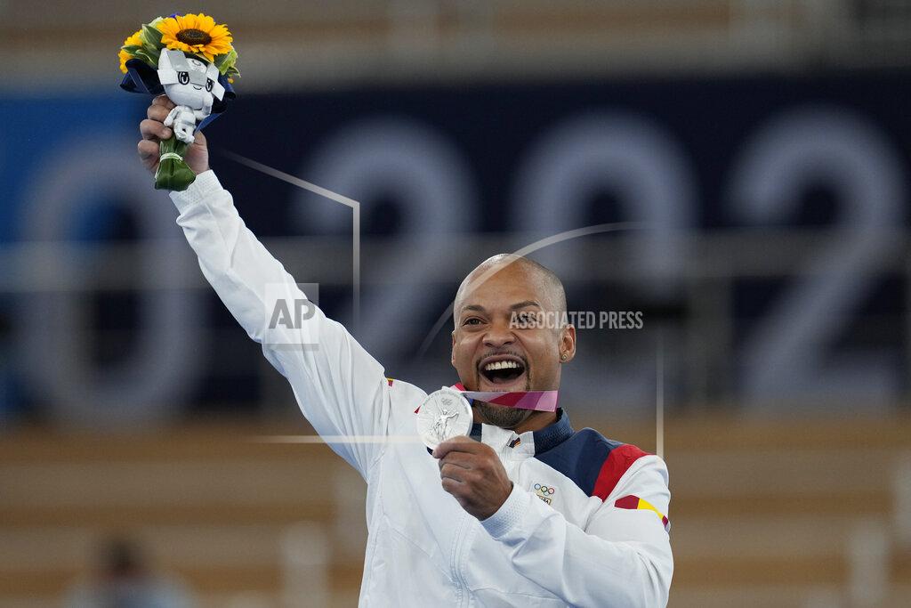 Rayderley Zapata of Spain, poses after winning the silver medal on the floor exercise during the artistic gymnastics men's apparatus final at the 2020 Summer Olympics, Sunday, Aug. 1, 2021, in Tokyo, Japan. (AP Photo/Natacha Pisarenko)