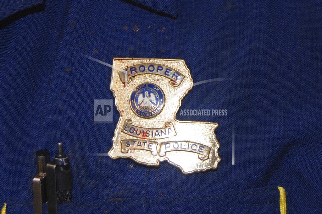 Uncredited This May 10, 2019 photo provided by the Louisiana State Police shows blood stains on the shield and uniform of Master Trooper Chris Hollingsworth, in West Monroe, La., after troopers punched, dragged and stunned Black motorist Ronald Greene during his fatal 2019 arrest. (Louisiana State Police via AP)