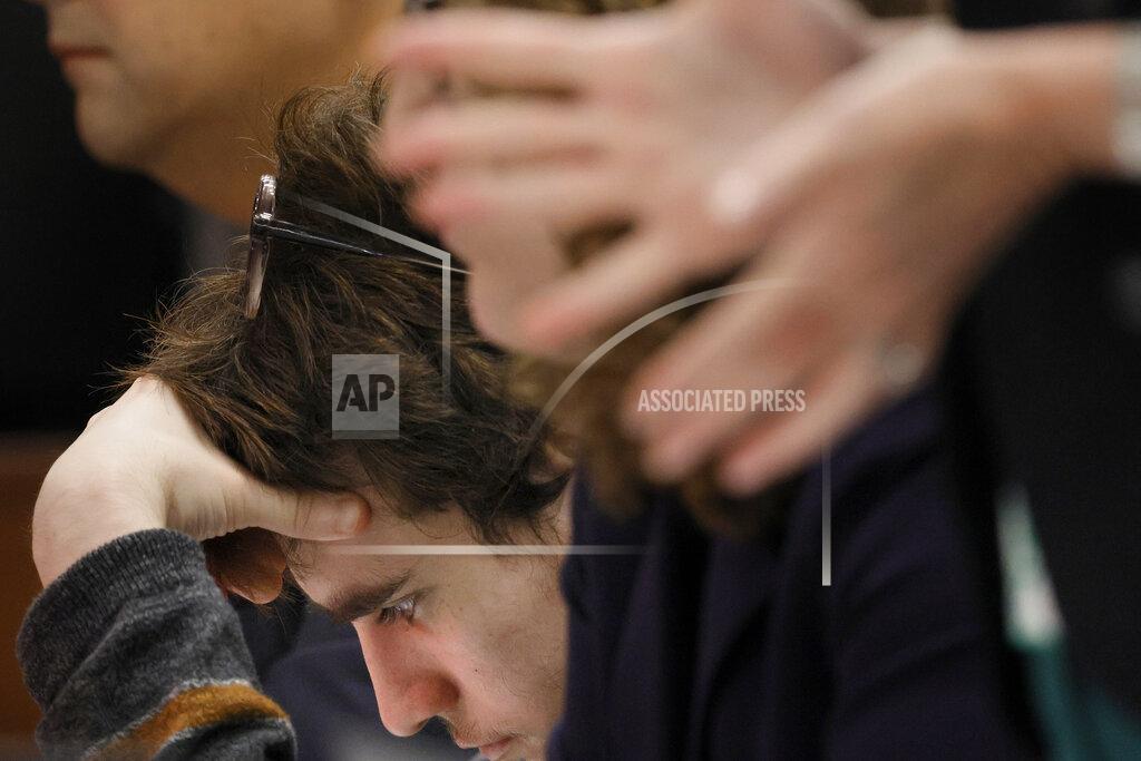 Amy Beth Bennett Marjory Stoneman Douglas High School shooter Nikolas Cruz holds his head as Assistant Public Defender Melisa McNeill questions a prospective juror during jury selection in the penalty phase of his trial at the Broward County Courthouse in Fort Lauderdale on Monday, May 23, 2022. Cruz previously plead guilty to all 17 counts of premeditated murder and 17 counts of attempted murder in the 2018 shootings. (Amy Beth Bennett/South Florida Sun Sentinel via AP, Pool)