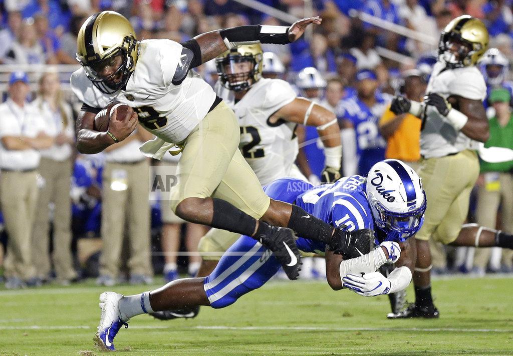 Duke's Marquis Waters (10) tackles Army quarterback Kelvin Hopkins Jr. (8) during the second half of an NCAA college football game in Durham, N.C., Friday, Aug. 31, 2018. Duke won 34-14. (AP Photo/Gerry Broome)