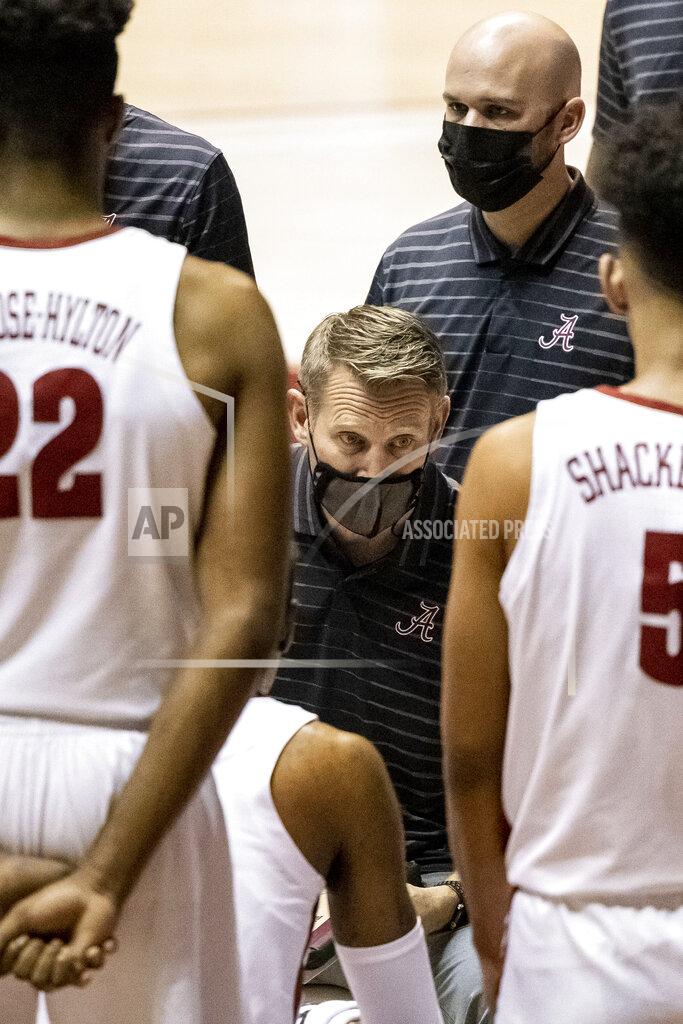 Vasha Hunt Alabama head coach Nate Oats works with his team during the first half of an NCAA college basketball game against Western Kentucky, Saturday, Dec. 19, 2020, in Tuscaloosa, Ala. (AP Photo/Vasha Hunt)
