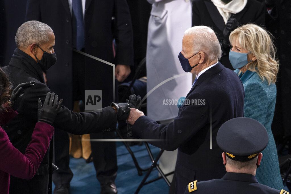Caroline Brehman President-elect Joe Biden greets former President Barack Obama as he arrives at the West Front of the Capitol, Wednesday, Jan. 20, 2021, in Washington. (Caroline Brehman/Pool Photo via AP)