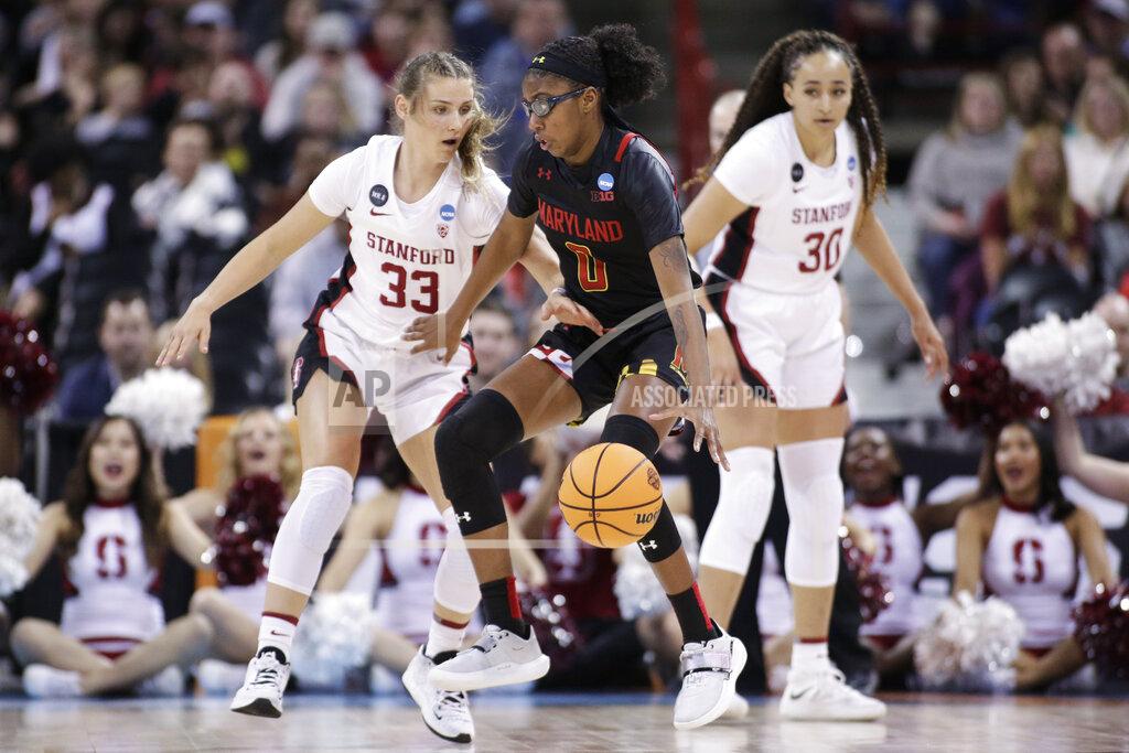 Young Kwak Maryland guard Shyanne Sellers (0) drives around Stanford guard Hannah Jump (33) during the first half of a college basketball game in the Sweet 16 round of the NCAA tournament, Friday, March 25, 2022, in Spokane, Wash. (AP Photo/Young Kwak)