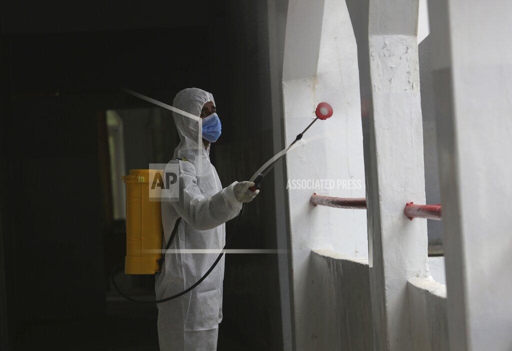Fareed Khan A worker sprays disinfectant in a school as preparations for reopening of educational institutions that were closed in March are finalized, in Karachi, Pakistan, Monday, Sept. 14, 2020. Education officials in Pakistan say authorities will start reopening educational institutions from Sept. 15 amid a steady decline in coronavirus deaths and infections. (AP Photo/Fareed Khan)