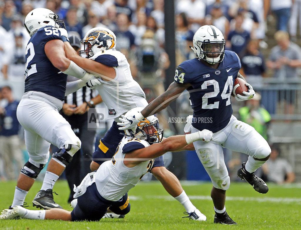 Chris Knight Penn State's Miles Sanders (24) gets past Kent State's Dalton Hicks (32) during the first half of an NCAA college football game in State College, Pa., Saturday, Sept. 15, 2018. (AP Photo/Chris Knight)