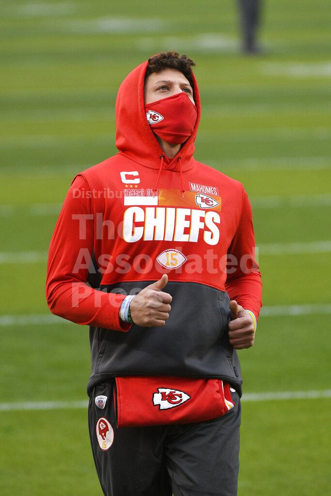 Kansas City Chiefs quarterback Patrick Mahomes runs on the field before the AFC championship NFL football game against the Buffalo Bills, Sunday, Jan. 24, 2021, in Kansas City, Mo. (AP Photo/Reed Hoffmann)