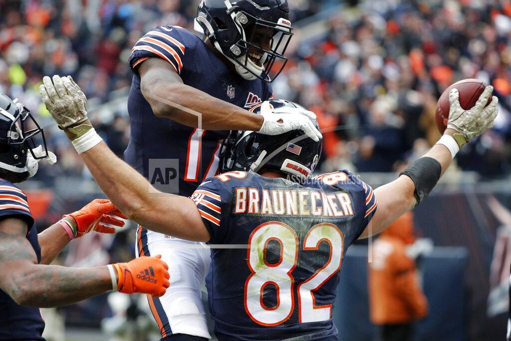 Charles Rex Arbogast Chicago Bears tight end Ben Braunecker (82) celebrates his 18-yard touchdown reception with Anthony Miller (17) during the first half of an NFL football game against the Detroit Lions in Chicago, Sunday, Nov. 10, 2019. (AP Photo/Charles Rex Arbogast)