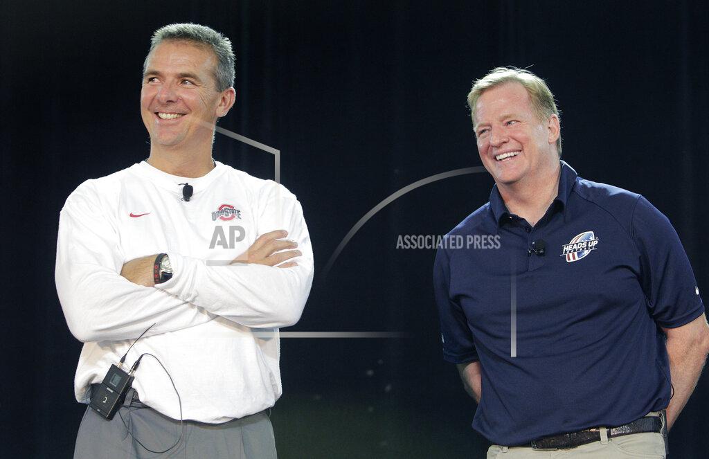 Jay Laprete FILE - NFL Commissioner Roger Goodell, right, and Ohio State NCAA college football head coach Urban Meyer answer questions during a safety clinic for mothers of youth football players in Columbus, Ohio, in this Thursday, Aug. 1, 2013, file photo. A person familiar with the search says Urban Meyer and the Jacksonville Jaguars are working toward finalizing a deal to make him the team's next head coach. The person spoke to The Associated Press on the condition of anonymity Thursday, Jan. 14, 2021, because a formal agreement was not yet in place. (AP Photo/Jay LaPrete, File)