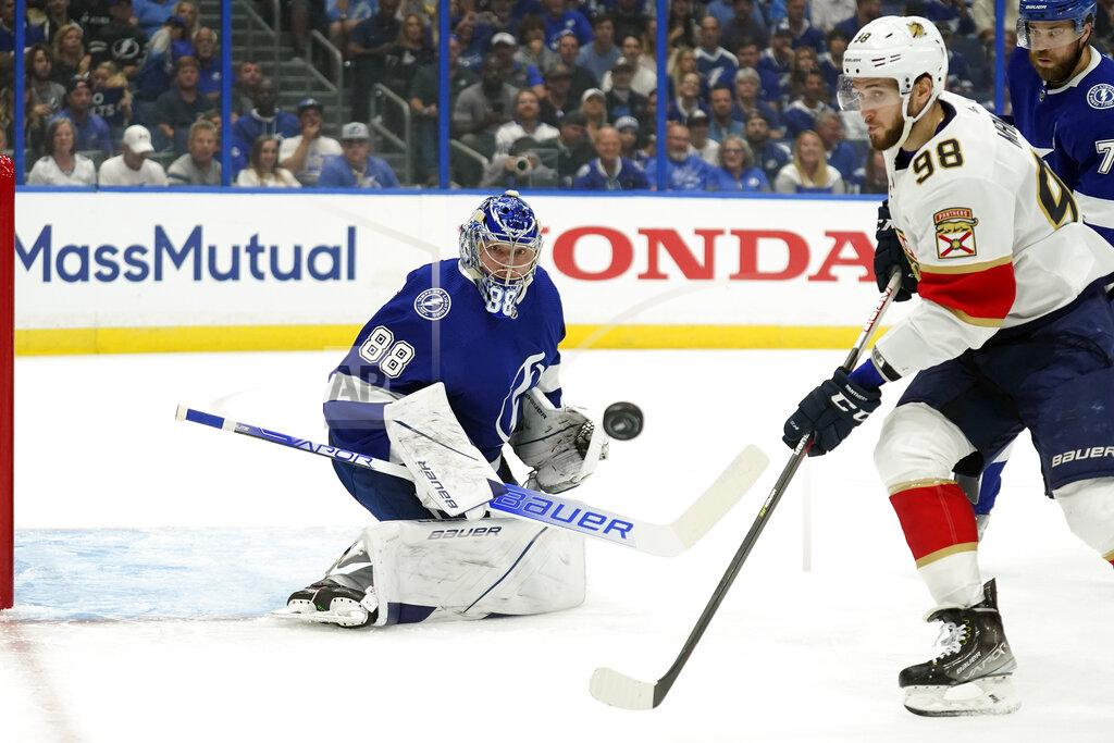 Chris O'MEara Tampa Bay Lightning goaltender Andrei Vasilevskiy (88) makes a save on a shot as Florida Panthers center Maxim Mamin (98) goes or the rebound during the first period in Game 4 of an NHL hockey second-round playoff series Monday, May 23, 2022, in Tampa, Fla. (AP Photo/Chris O'Meara)