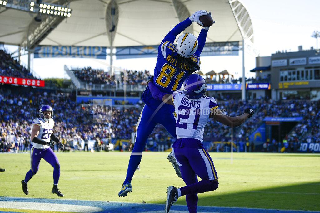 Kelvin Kuo Los Angeles Chargers wide receiver Mike Williams (81) grabs a touchdown catch in the end zone as Minnesota Vikings cornerback Mike Hughes (21) defends during the first half of an NFL football game Sunday, Dec. 15, 2019, in Carson, Calif. (AP Photo/Kelvin Kuo)