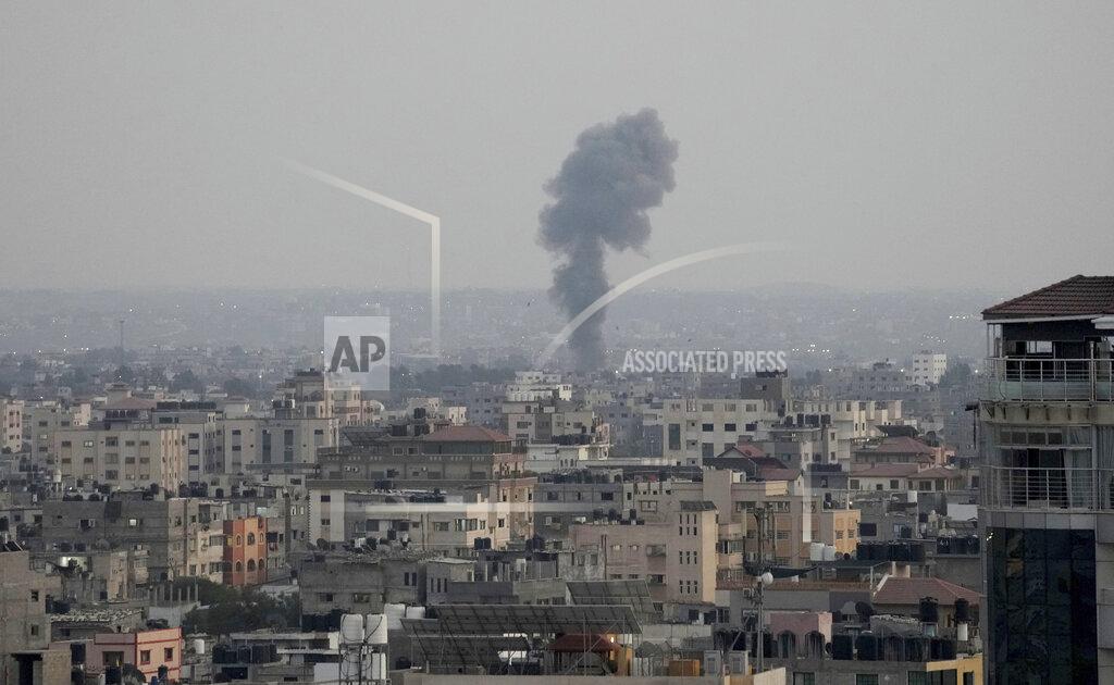 Hatem Moussa Smoke rises following Israeli airstrikes on a building in Gaza City, Friday, Aug. 5, 2022. Palestinian officials say Israeli airstrikes on Gaza have killed several people, including a senior militant, and wounded 40 others. (AP Photo/Hatem Moussa)