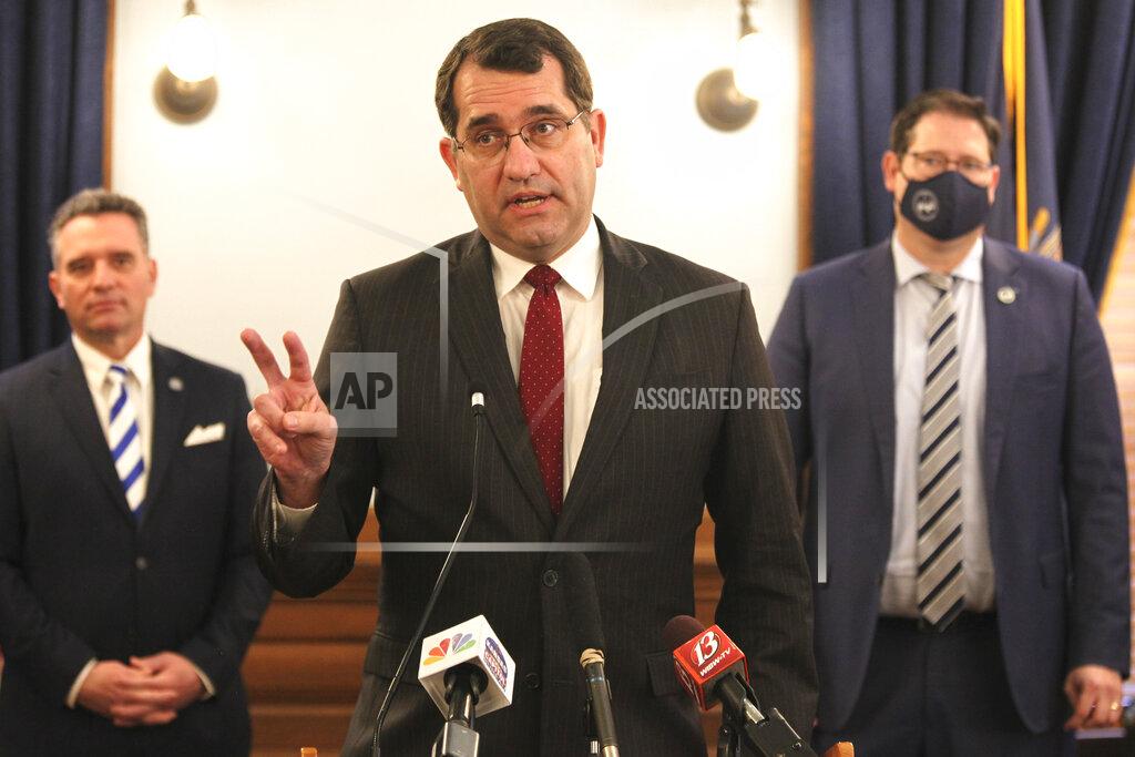 John Hanna Kansas Attorney General Derek Schmidt discusses a proposal that he's pushing with other Republicans to amend the state constitution to give the Legislature the power to overturn state agencies' administrative regulations, at a news conference, Tuesday, Feb. 23, 2021, at the Statehouse in Topeka, Kan. Behind him are Senate President Ty Masterson, left, R-Andover, and House Speaker Ron Ryckman Jr., right, R-Olathe. (AP Photo/John Hanna)