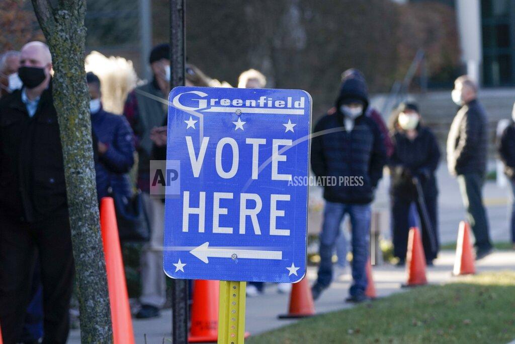 Morry Gash People line up to vote outside the Greenfield Community Center Tuesday, Nov. 3, 2020, in Greenfield, Wis. (AP Photo/Morry Gash)