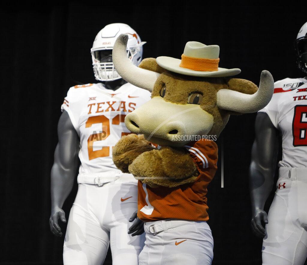 David Kent Texas mascot Hook'em poses on stage with team uniforms on the first day of Big 12 Conference NCAA college football media days Monday, July 15, 2019, at AT&T Stadium in Arlington, Texas. (AP Photo/David Kent)
