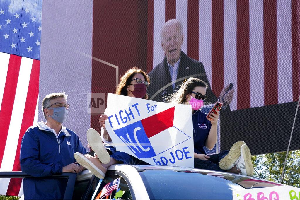 Carolyn Kaster Supporters listen as Democratic presidential candidate former Vice President Joe Biden speaks during a campaign event at Riverside High School in Durham, N.C., Sunday, Oct. 18, 2020. (AP Photo/Carolyn Kaster)