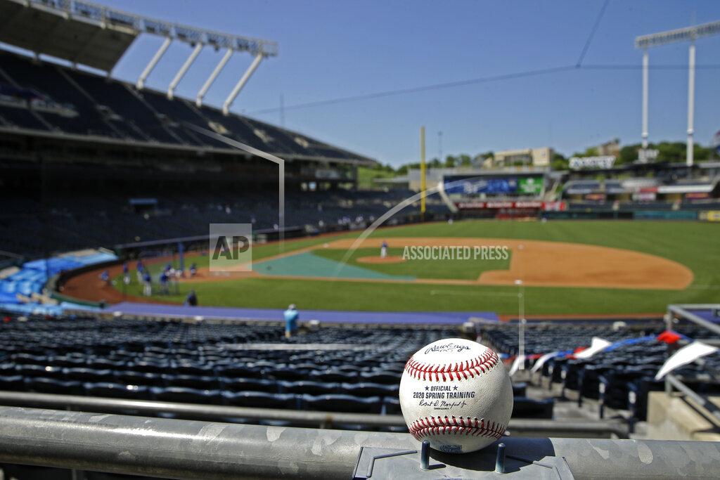 A foul ball rests in empty stands during Kansas City Royals' baseball practice at Kauffman Stadium on Thursday, July 9, 2020, in Kansas City, Mo. (AP Photo/Charlie Riedel)