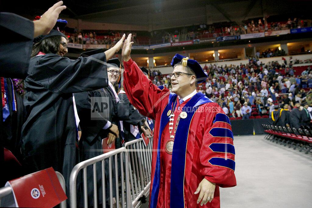 Cary Edmondson In this May 19, 2018, photo provided by California State University, Fresno State President Dr. Joseph Castro greeting graduates during commencement ceremonies at the university in Fresno, Calif. The California State University system has named Fresno State President Dr. Castro as its next chancellor. He replaces outgoing Chancellor Timothy White to become the first Mexican-American and native Californian to lead the nation’s largest four-year public university system. California State University’s Board of Trustees announced Castro's appointment on Wednesday, Sept. 23, 2020. (Cary Edmondson/California State University via AP)