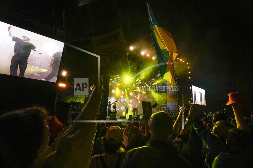 Luca Bruno Kalush Orchestra from Ukraine perform at the Eurovision Village in Turin, Italy, Wednesday, May 11, 2022. (AP Photo/Luca Bruno)