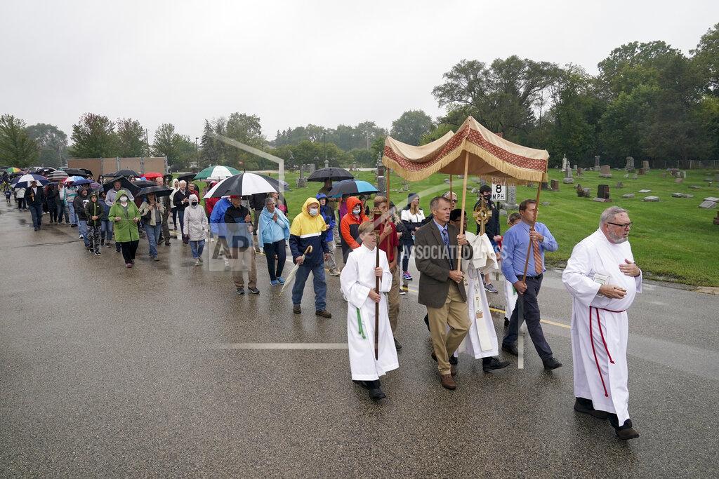 Morry Gash Churchgoers participate in a procession at the Holy Apostles Church in Milwaukee, Saturday, Sept. 12, 2020. For decades, Roman Catholic voters have been a pivotal swing vote in U.S. presidential elections, with a majority backing the winner — whether Republican or Democrat — nearly every time. (AP Photo/Morry Gash)