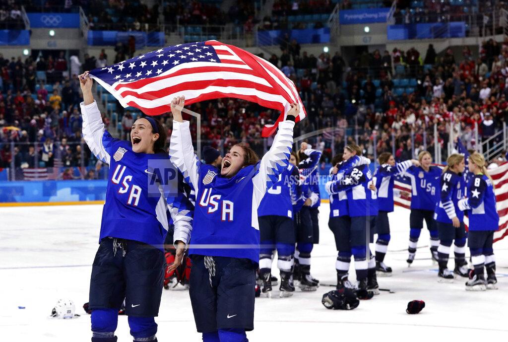 Frank Franklin Ii FILE - United States players celebrate after winning the women's gold medal hockey game against Canada at the 2018 Winter Olympics in Gangneung, South Korea, Feb. 22, 2018. The United States is the defending Olympic champion after beating Canada in an exceptionally nail-biting 3-2 shootout win at South Korea to end Canada's run of four gold medals. (AP Photo/Frank Franklin II, File)