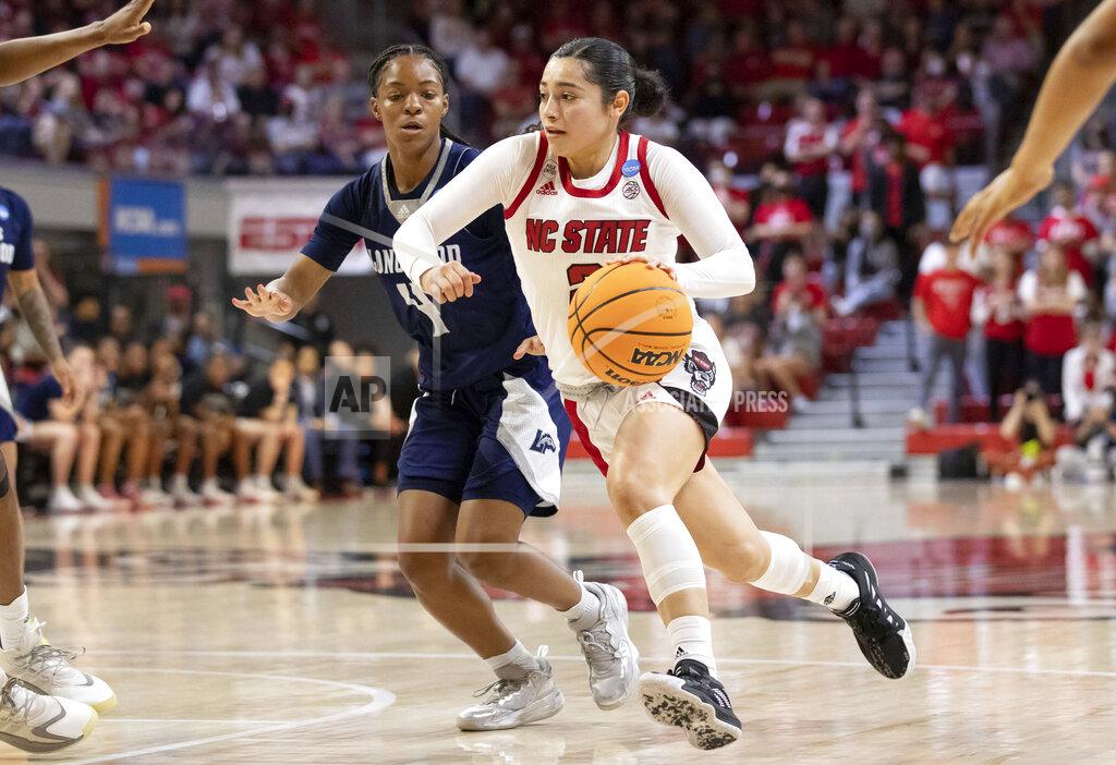 Ben Mckeown North Carolina State's Raina Perez, right, drives past Longwood's Kennedy Calhoun (4) during the second half of a college basketball game in the first round of the NCAA tournament in Raleigh, N.C., Saturday, March 19, 2022. (AP Photo/Ben McKeown)