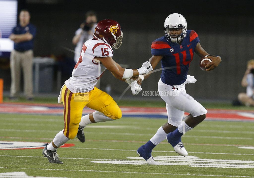 Rick Scuteri Arizona quarterback Khalil Tate stiff arms Southern California safety Talanoa Hufanga (15) in the second half during an NCAA college football game, Saturday, Sept. 29, 2018, in Tucson, Ariz. Southern California defeated Arizona 24-20. (AP Photo/Rick Scuteri)